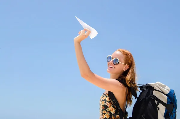 Backpacker with paper plane — Stock Photo, Image