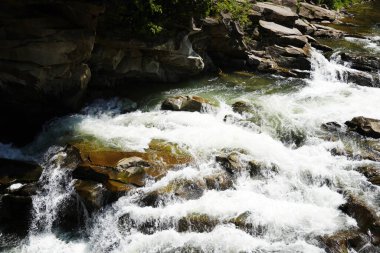mountain river rapids - a mini waterfall