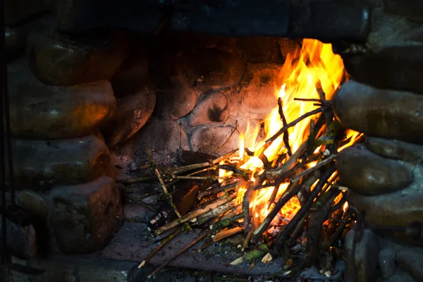 Fire in a rustic fireplace — Stock Photo, Image