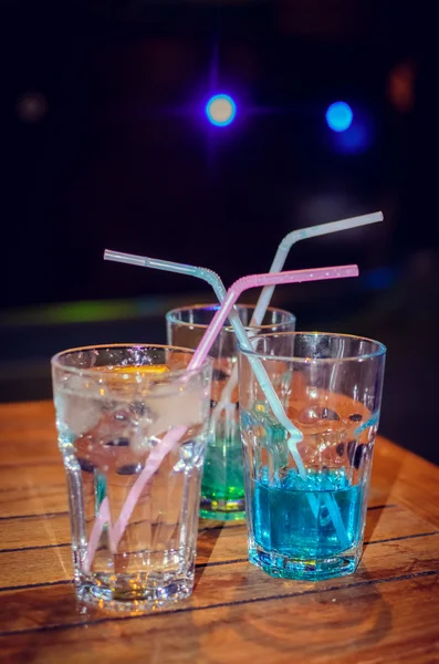 Blue cocktail on bar background