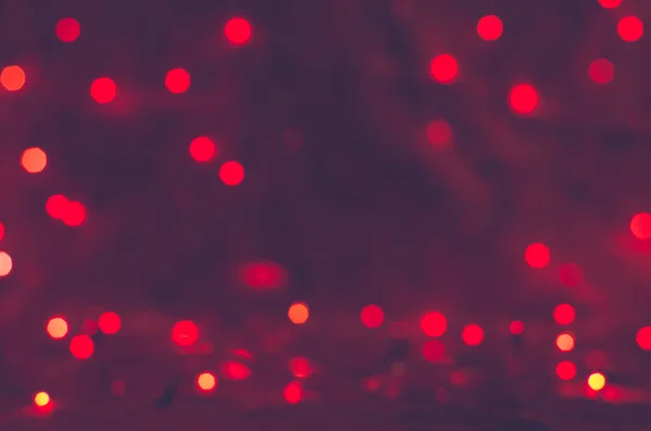 Rode bokeh textuur Kerstmis achtergrond — Stockfoto