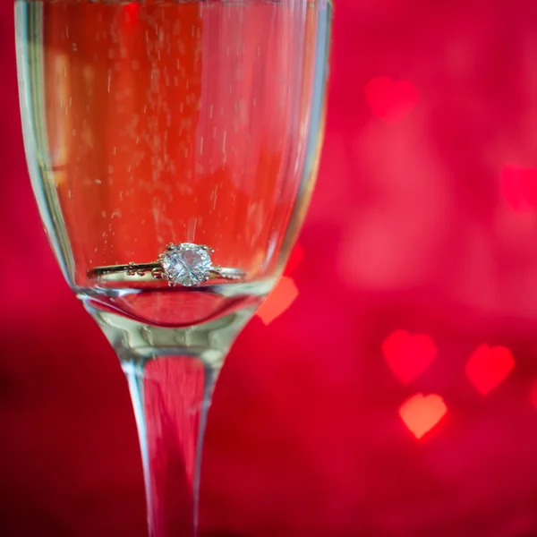 Proposal with ring in champagne glass — Stock Photo, Image