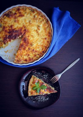 Quiche lorraine pie with chicken, mushrooms and broccoli