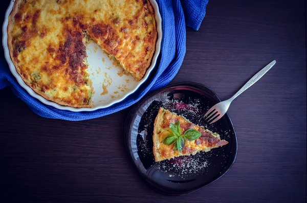 Quiche lorraine pie with chicken, mushrooms and broccoli