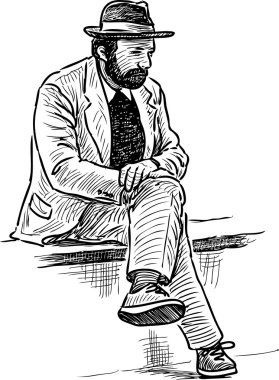 kişi bir parkta bankta