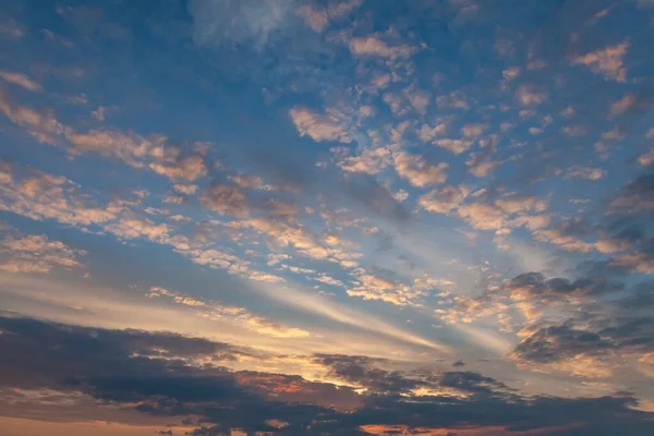 Clouds are painted by the setting sun