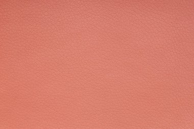 Background image - terracotta leather with textured abstract pattern.