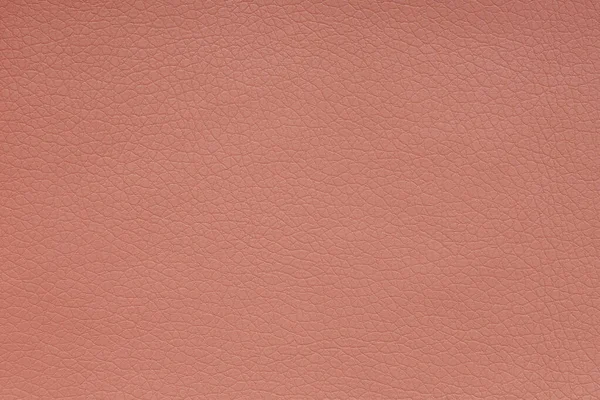 Background image - terracotta leather with textured abstract pattern.