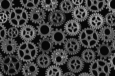 Vites arkaplanı soyut. Farklı metallerden yapılmış ürünler. Makro fotoğraf. Siyah beyaz görüntü. Yakın plan..