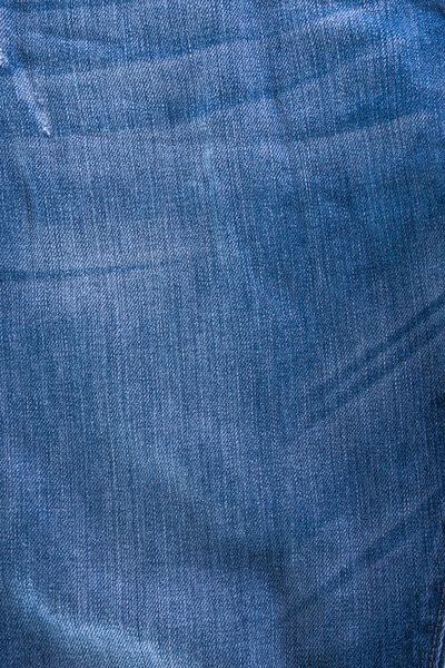 обветшалые синие джинсы текстура смята
