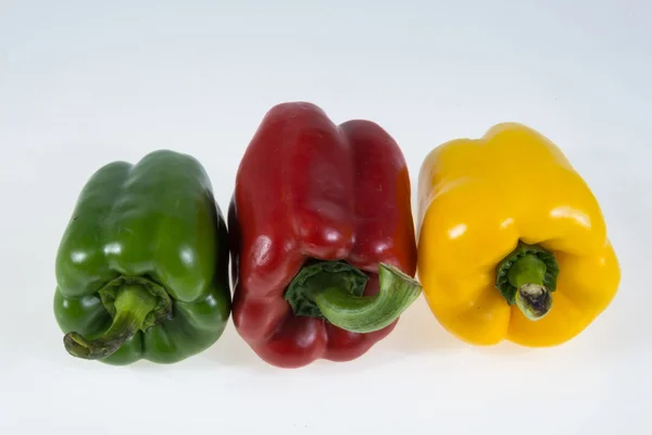 Red, yellow and green bell peppers — Stock Photo, Image