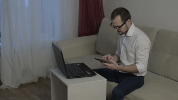Man working from home with laptop — Stock Video