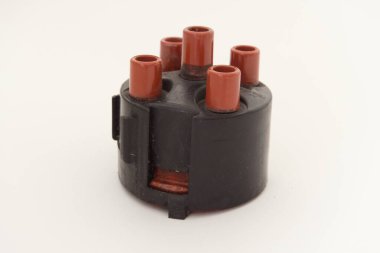 Automotive ignition distributor cap isolated on white - car engine spare part