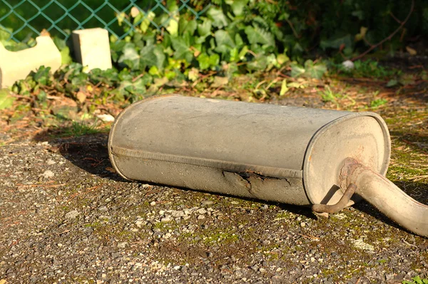 Very rusty exhaust from a car — Stock Photo, Image