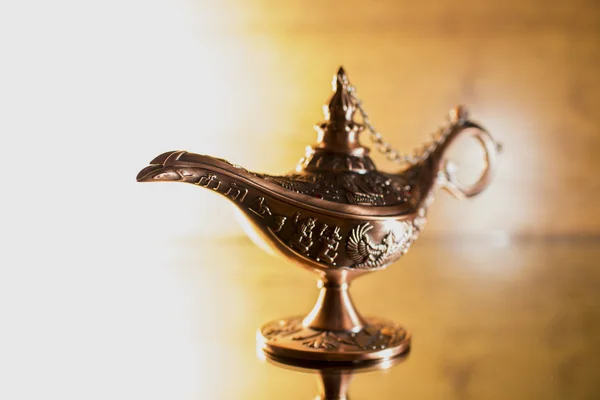 Aladdin's lamp on bright background — Stock Photo, Image