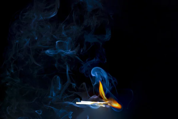 Blue smoke and matches — Stock Photo, Image