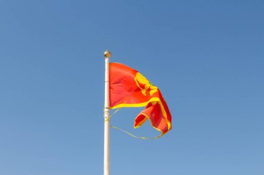 Montenegro flag on blue sky background 