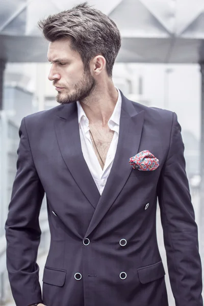 Portrait of a man in the jacket on a city background — Stock Photo, Image