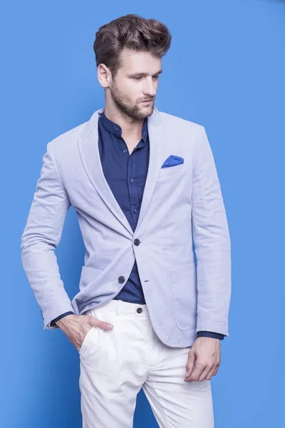 Handsome man in a dark blue shirt and blue jacket — Stock Photo, Image