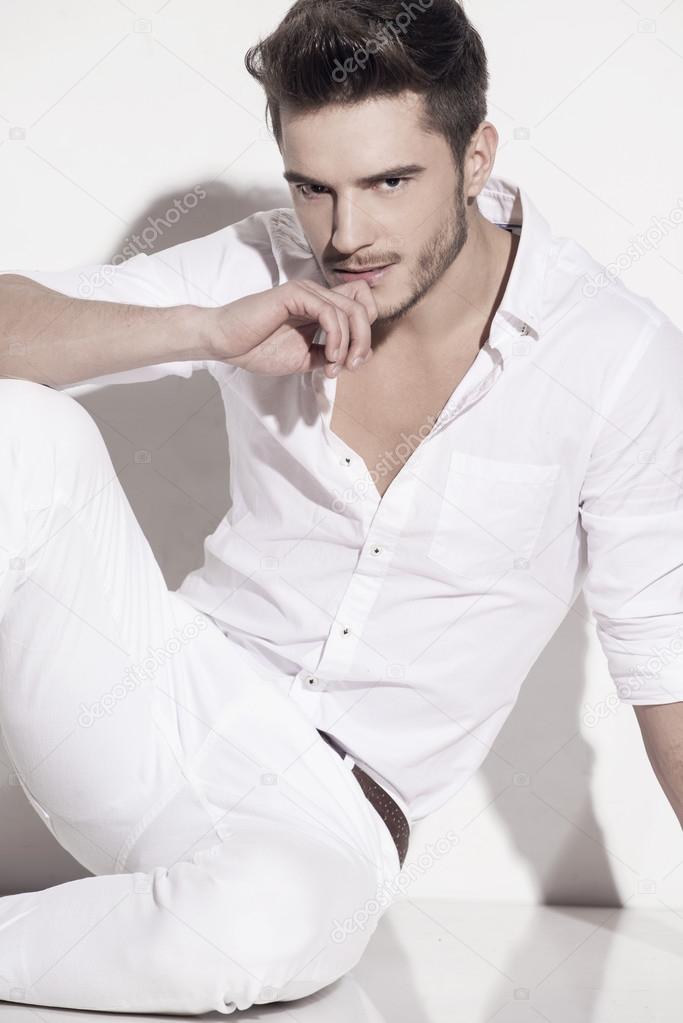 Handsome man elegantly dressed in white