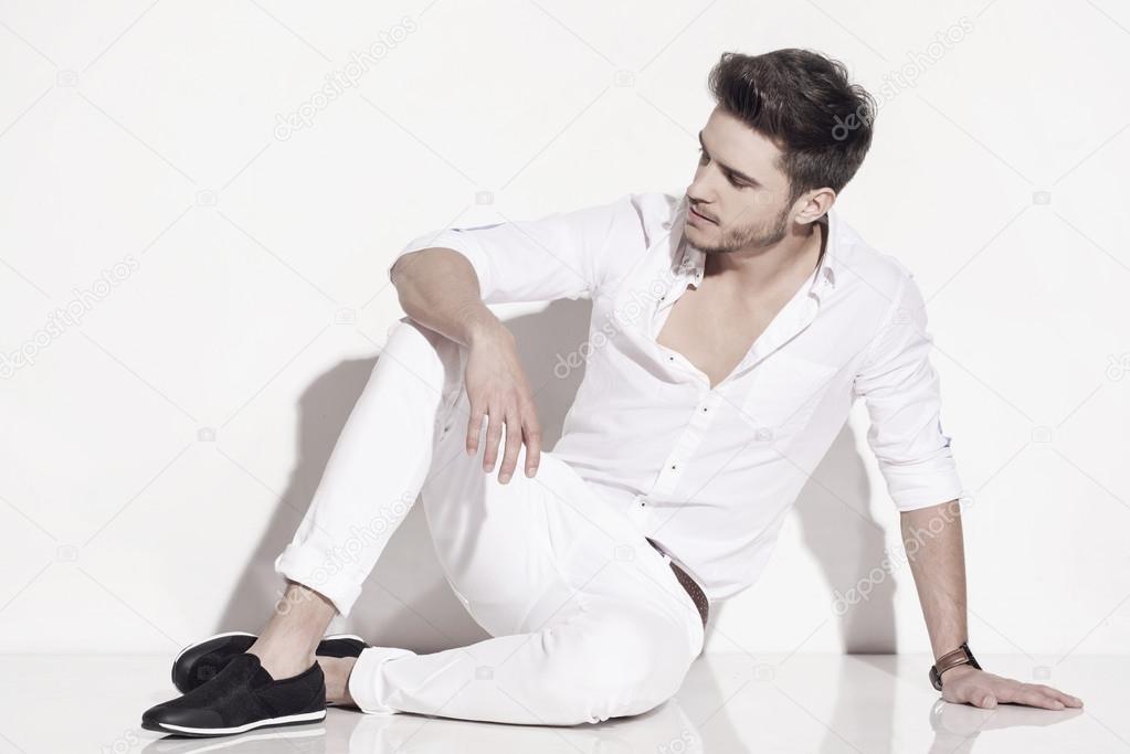 Handsome man elegantly dressed in white