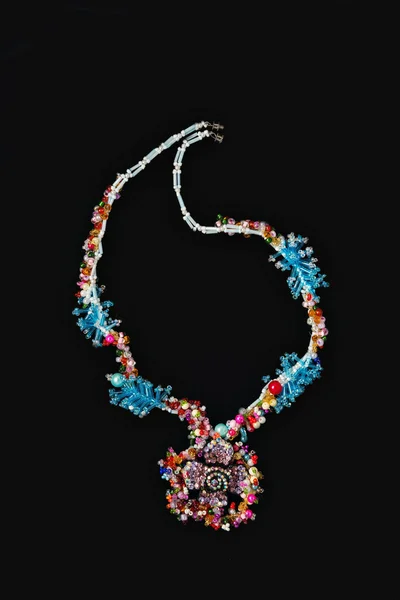 Necklace on a black background in close up. beaded necklace — Stock Photo, Image