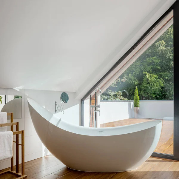 Stylish design freestanding bathtub in elegant attic bathroom with big window and terrace — Stock Image Stylish Design Freestanding Bathtub Elegant Attic Bathroom Big Window Terrace Stock Photo