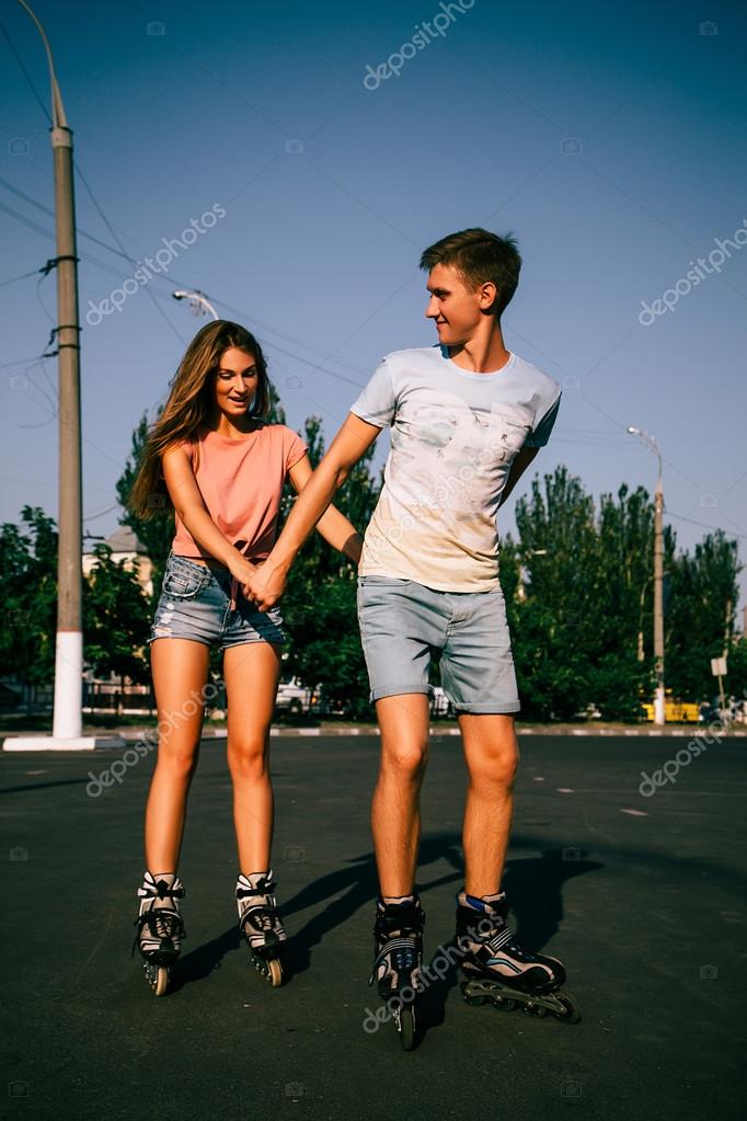 A couple rollerskating at sunset — Stock Photo © YuliiaChupina 112988354