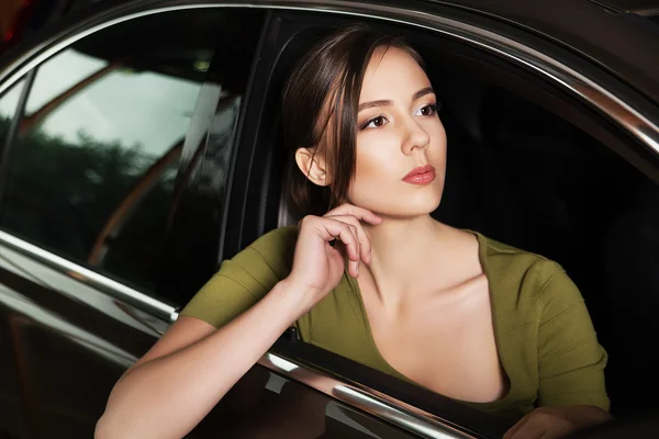 Girl sitting in the car — Stock Photo, Image