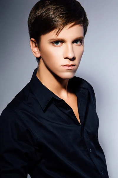 Studio photo of young  man on gray background — Stock Photo, Image