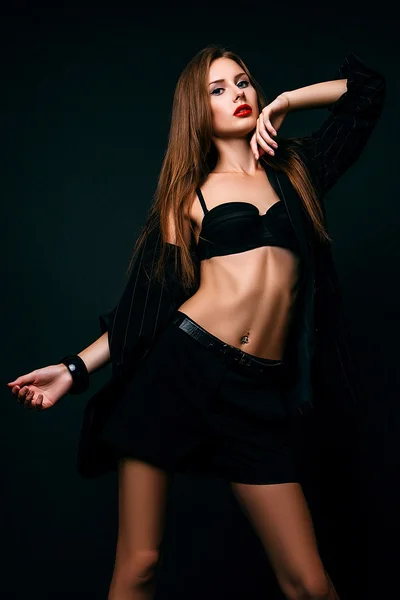 Studio photo of young  woman on black background — Stock Photo, Image