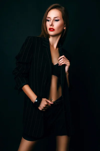 Studio photo of young  woman on black background — Stock Photo, Image