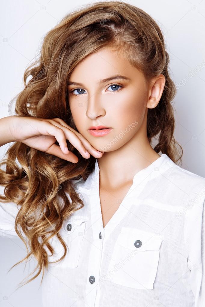A beautiful blond-haired 13-years old girl in studio on white background — Stock Photo ...