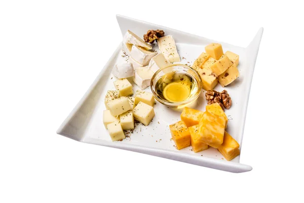 Cheese plate Assortment of various types of cheese and honey on white plate — Stock Photo, Image