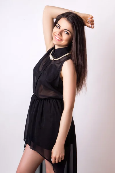 Fashion style studio photo of a cute brunette, on white background — Stock Photo, Image