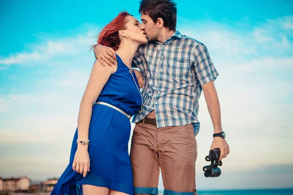 A young couple enjoys a mid summer late afternoon, on a wet san — Stock Fotó