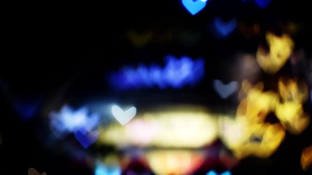Desenfoque y bokeh corazón forma amor San Valentín colorida luz de la noche del centro comercial — Vídeo de stock