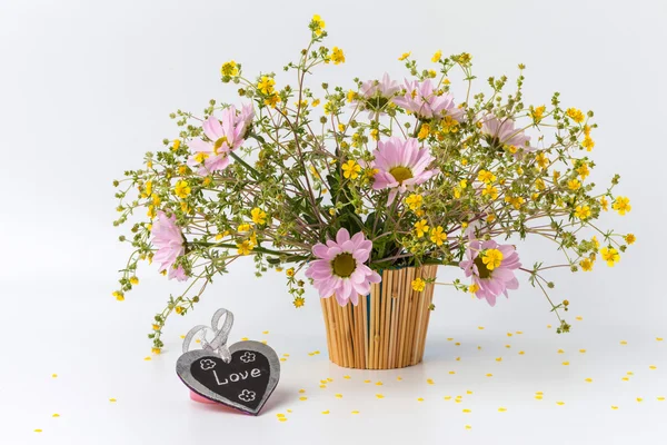 Old tag and flowers on white background — Stock Photo, Image