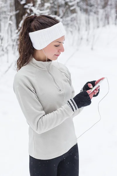 woman listening to music and jogging