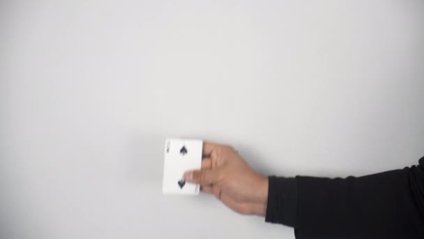 Closeup hands of magician is making trick shaking hand and changing card in air. — Stock Video