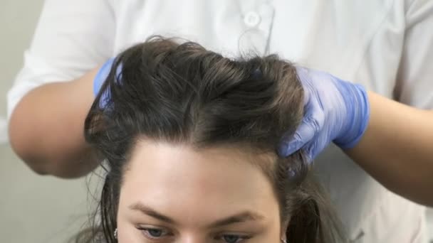 Doctor trichologist massaging womans head skin after mesotherapy injections. — Stock Video