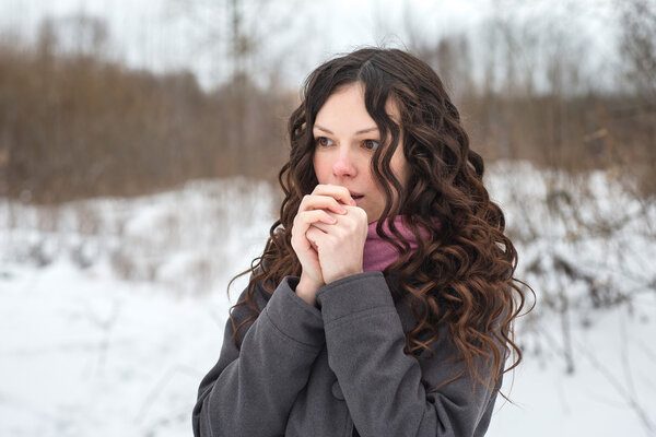 Beautiful girl freezes in winter