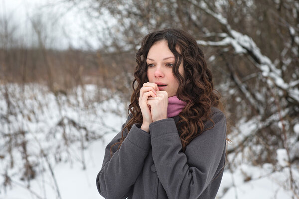 Beautiful girl freezes in winter