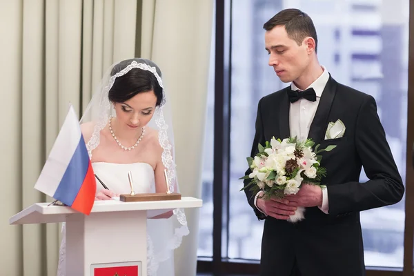 Bride and groom on marriage registration — Stock Photo, Image