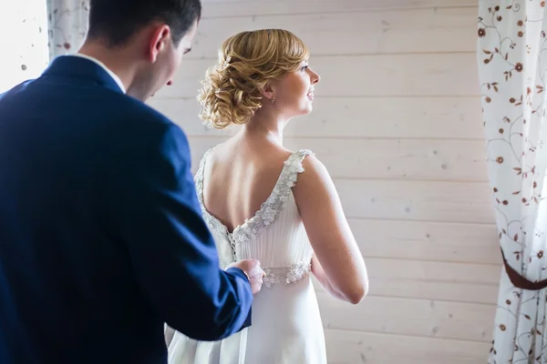 Bride and groom with wedding dress — Stock Photo, Image