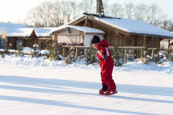 Happy child skating in winter at the rink — Zdjęcie stockowe