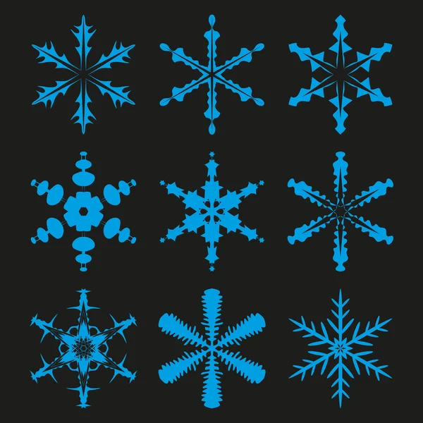 Étoiles d'hiver et flocons de neige — Image vectorielle