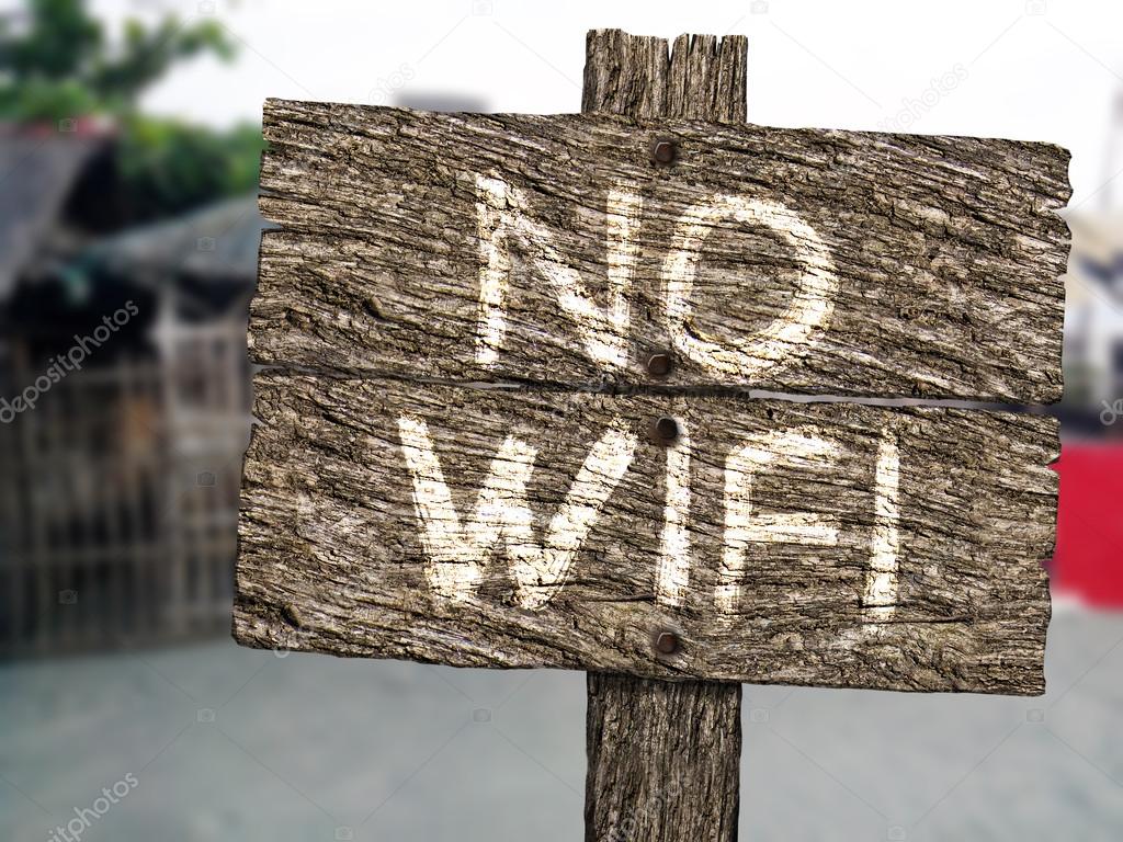No Wifi Rustic Wood Sign on Beach — Stock Photo ©
