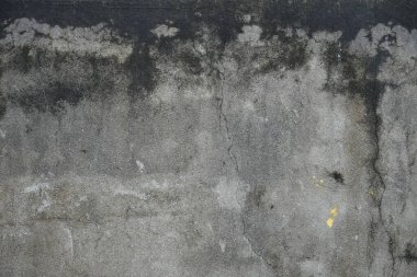 Lekeli ve desenli gri beton bir duvarın detaylı görüntüsü