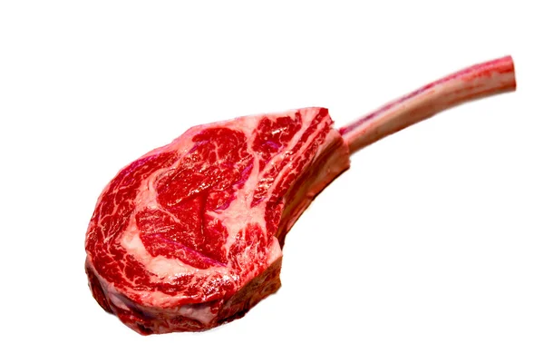 Steak the Tomahawk rests on a white background. Insulated — Stock Photo, Image